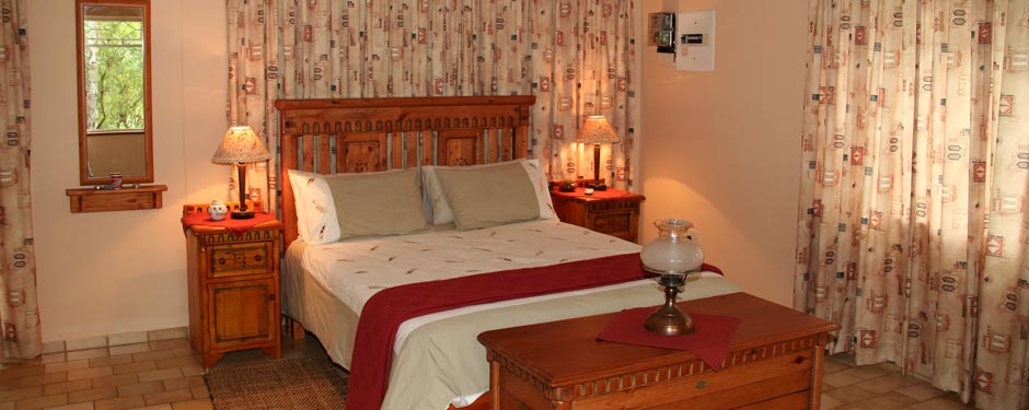 Warm wooden bedroom with soft lamp light